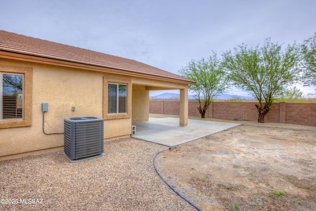 7077 S Cottontail Run Ave, Tucson, AZ 85756 - fenced backyard featuring central air condition unit and a patio area