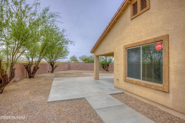 7077 S Cottontail Run Ave, Tucson, AZ 85756 - fenced backyard featuring a patio area