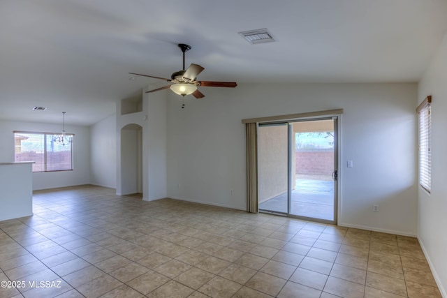 7077 S Cottontail Run Ave, Tucson, AZ 85756 - empty room with lofted ceiling, ceiling fan, a chandelier, light tile patterned floors, and baseboards