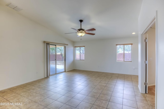 7077 S Cottontail Run Ave, Tucson, AZ 85756 - empty room featuring healthy amount of natural light, a ceiling fan, light tile patterned flooring, vaulted ceiling, and recessed lighting
