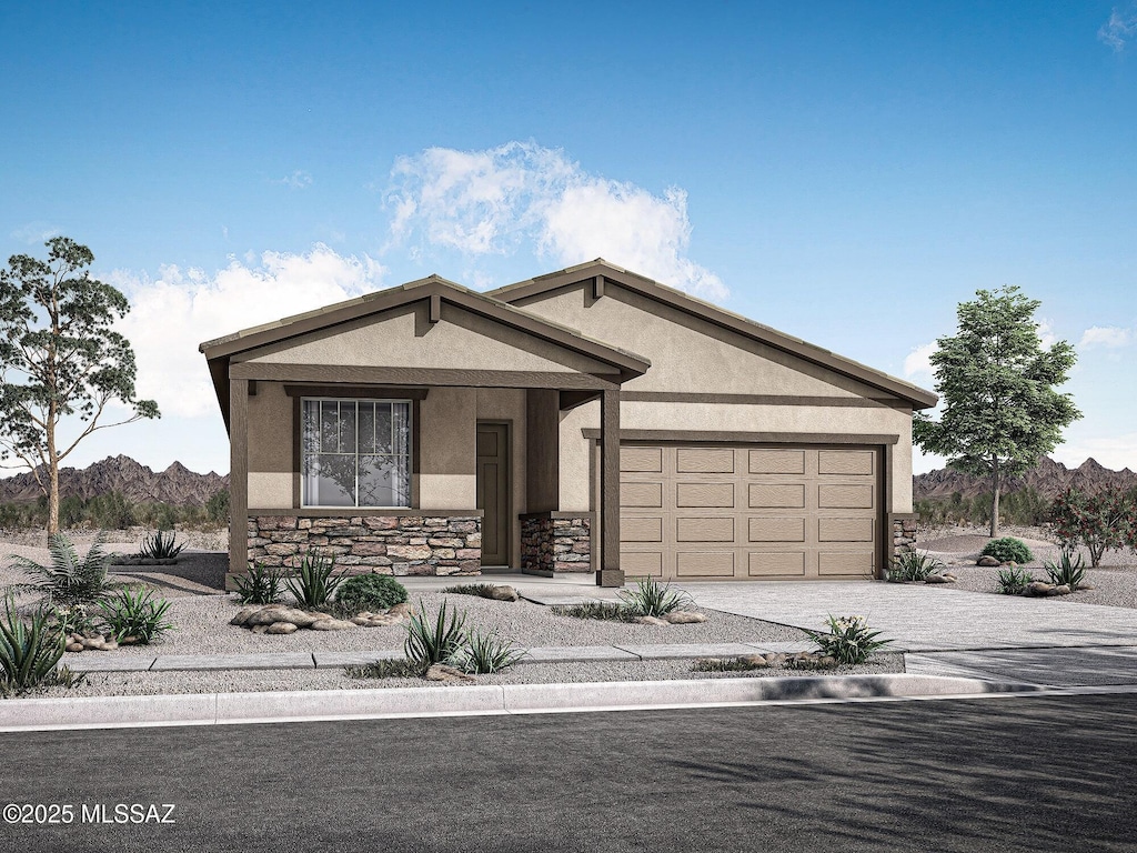 10128 S Arnold Ranch Ct, Vail, AZ 85641 - single story home with stucco siding, stone siding, a garage, decorative driveway, and a mountain view