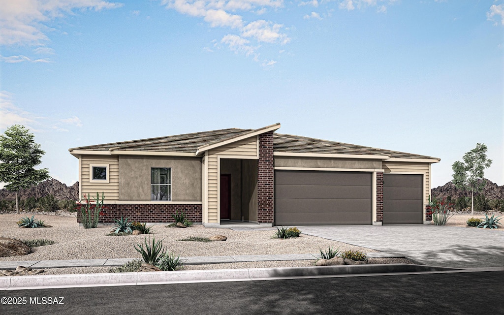 12775 E Tortoise Pointe Dr, Vail, AZ 85641 - view of front of property featuring an attached garage, decorative driveway, and brick siding