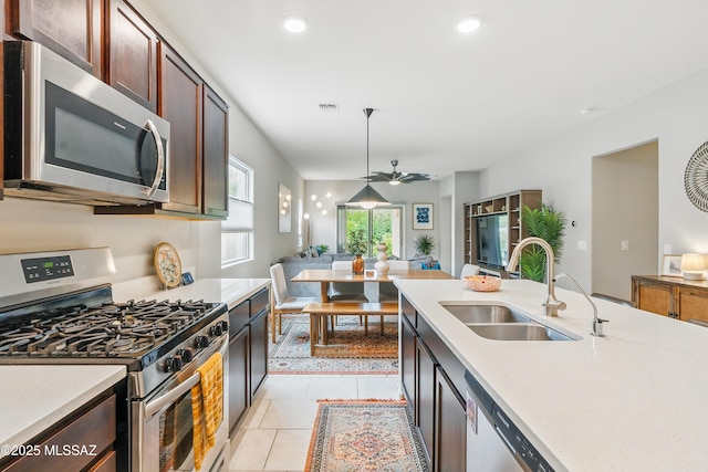 208 E Calle Trona, Green Valley, AZ 85614 - kitchen with appliances with stainless steel finishes, a sink, light countertops, a ceiling fan, and recessed lighting