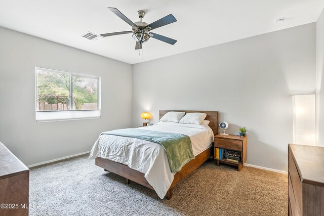 208 E Calle Trona, Green Valley, AZ 85614 - carpeted bedroom with baseboards and ceiling fan