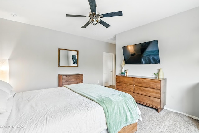 208 E Calle Trona, Green Valley, AZ 85614 - bedroom with light carpet, baseboards, and ceiling fan
