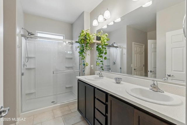 208 E Calle Trona, Green Valley, AZ 85614 - bathroom featuring a stall shower, tile patterned flooring, and double vanity