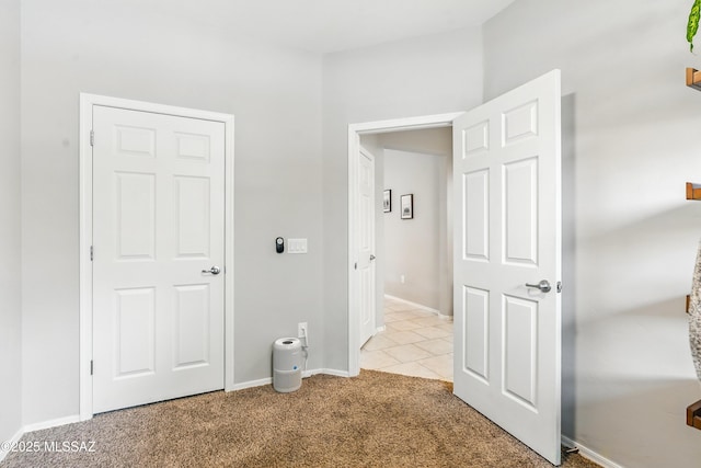 208 E Calle Trona, Green Valley, AZ 85614 - hall featuring carpet flooring, baseboards, and tile patterned flooring