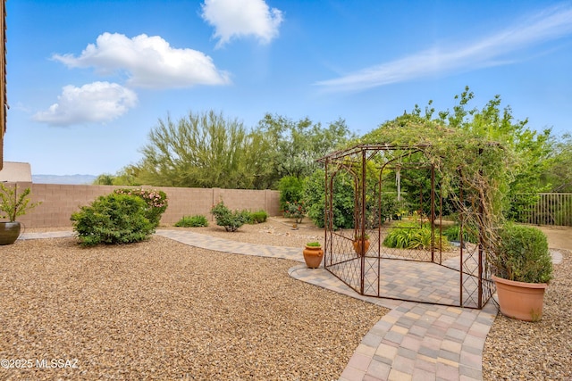208 E Calle Trona, Green Valley, AZ 85614 - fenced backyard featuring a patio area