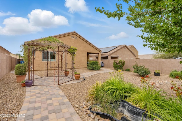 208 E Calle Trona, Green Valley, AZ 85614 - view of front of house with a gazebo, stucco siding, a patio, and a fenced backyard