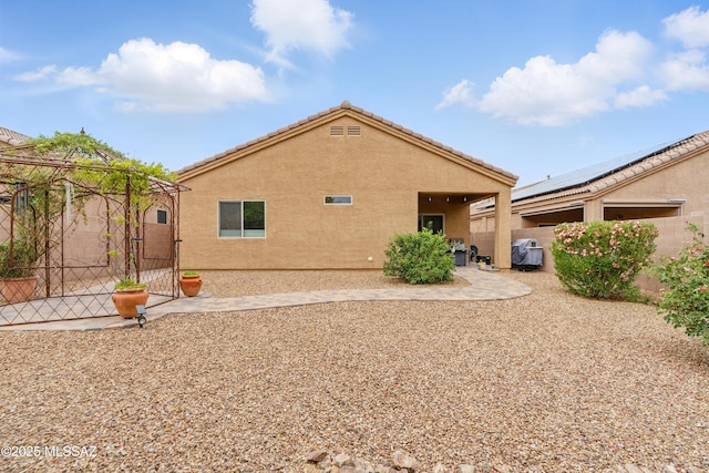 208 E Calle Trona, Green Valley, AZ 85614 - back of property featuring a patio, a fenced backyard, and stucco siding