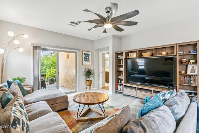 208 E Calle Trona, Green Valley, AZ 85614 - living room with a ceiling fan, light tile patterned flooring, and baseboards