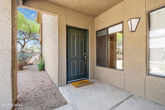 5751 N Kolb Rd Unit 23104, Tucson, AZ 85750 - doorway to property featuring stucco siding