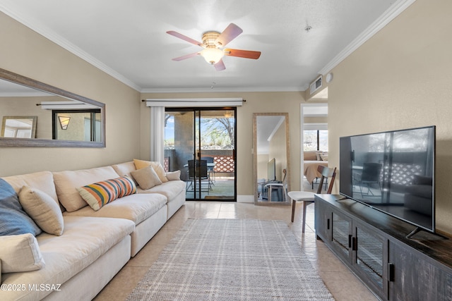 5751 N Kolb Rd Unit 23104, Tucson, AZ 85750 - living area with light tile patterned floors, crown molding, a ceiling fan, and baseboards