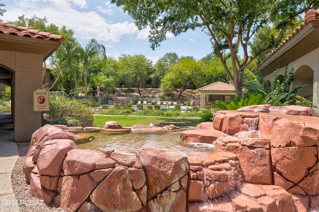 5751 N Kolb Rd Unit 23104, Tucson, AZ 85750 - view of yard with a garden pond