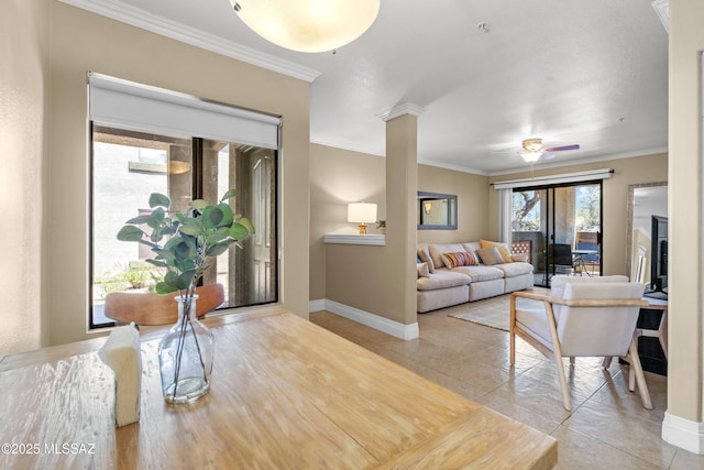 5751 N Kolb Rd Unit 23104, Tucson, AZ 85750 - living area featuring ornamental molding, light tile patterned flooring, baseboards, a ceiling fan, and decorative columns