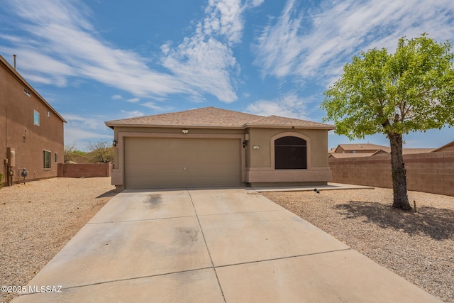 7797 S Cobble Hill Ct, Tucson, AZ 85756 - view of front of property with concrete driveway, an attached garage, and stucco siding