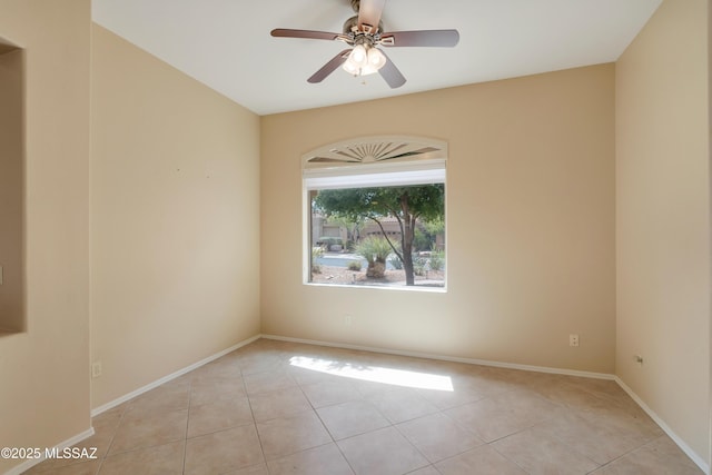 6321 N Via Lomas De Paloma, Tucson, AZ 85718 - spare room featuring light tile patterned flooring, ceiling fan, and baseboards