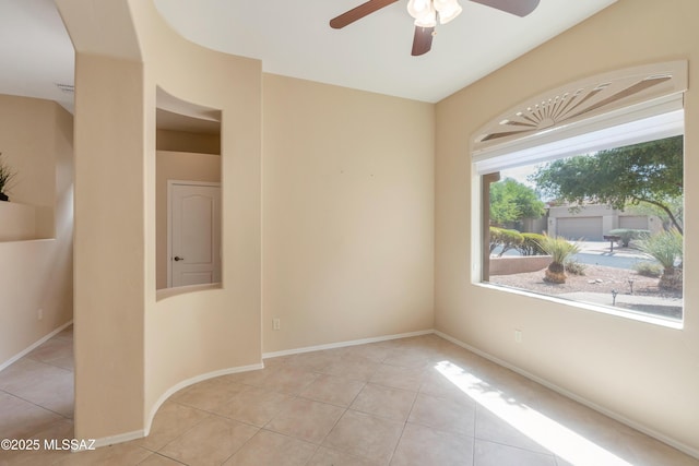 6321 N Via Lomas De Paloma, Tucson, AZ 85718 - tiled spare room with a ceiling fan and baseboards