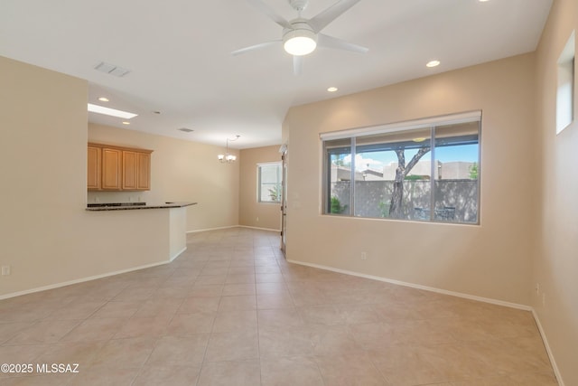 6321 N Via Lomas De Paloma, Tucson, AZ 85718 - unfurnished living room featuring a chandelier, recessed lighting, ceiling fan, light tile patterned floors, and baseboards