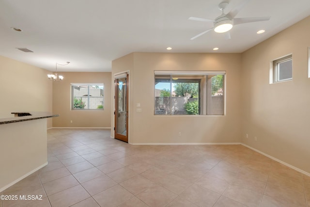 6321 N Via Lomas De Paloma, Tucson, AZ 85718 - unfurnished room with plenty of natural light, a chandelier, ceiling fan, recessed lighting, and baseboards
