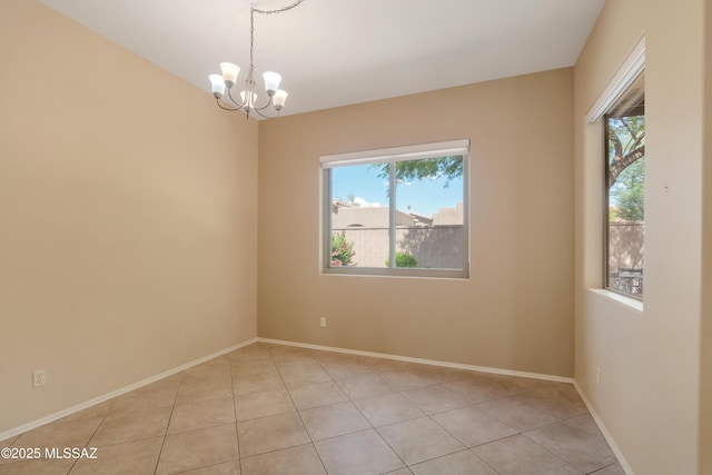 6321 N Via Lomas De Paloma, Tucson, AZ 85718 - unfurnished room featuring plenty of natural light, a chandelier, and light tile patterned floors