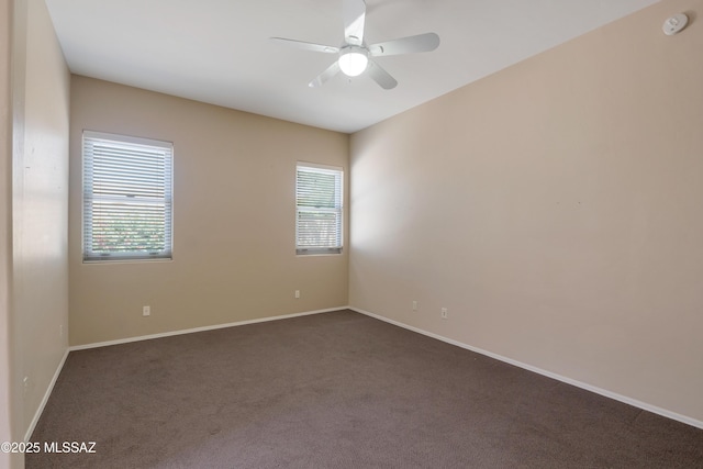 6321 N Via Lomas De Paloma, Tucson, AZ 85718 - spare room featuring dark carpet, ceiling fan, baseboards, and a smoke detector