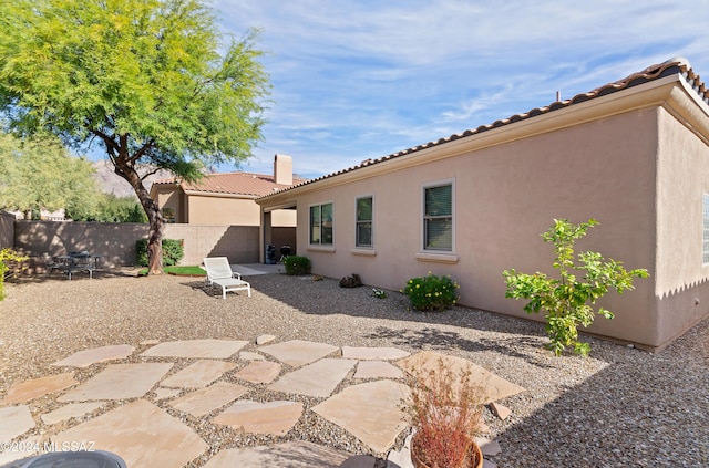6321 N Via Lomas De Paloma, Tucson, AZ 85718 - rear view of property with a tile roof, stucco siding, a chimney, and a patio area