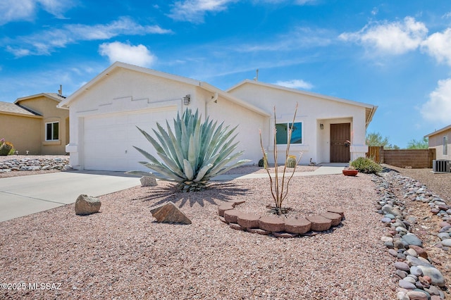 10140 E Pleasant View Way, Tucson, AZ 85748 - ranch-style house with an attached garage, stucco siding, driveway, and cooling unit