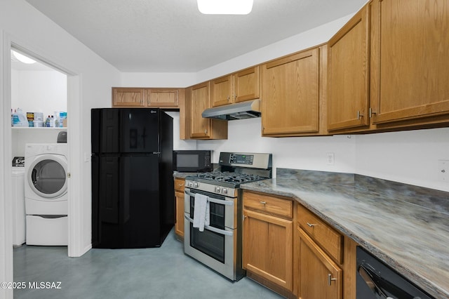 10140 E Pleasant View Way, Tucson, AZ 85748 - kitchen with black appliances, under cabinet range hood, washer / dryer, and brown cabinets