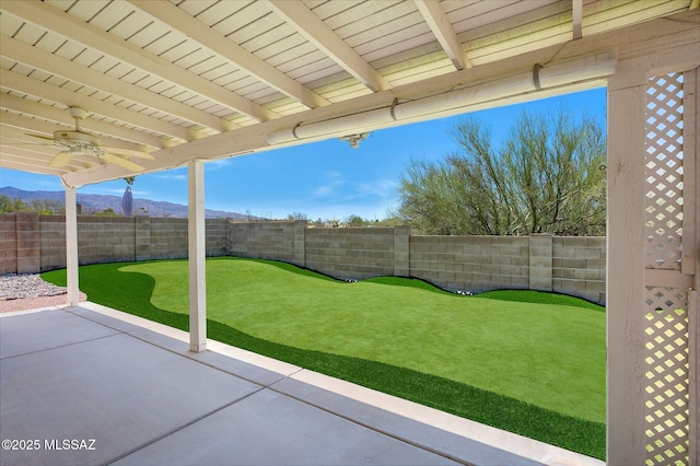 10140 E Pleasant View Way, Tucson, AZ 85748 - fenced backyard featuring a ceiling fan, a patio area, and a mountain view