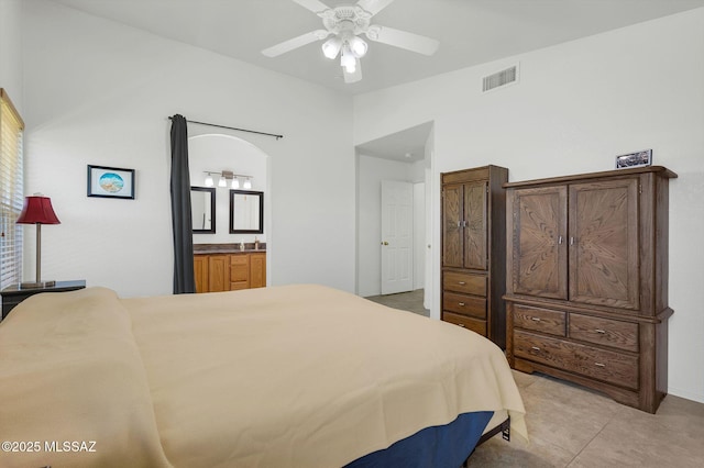 10140 E Pleasant View Way, Tucson, AZ 85748 - bedroom with ensuite bathroom, light tile patterned flooring, and a ceiling fan