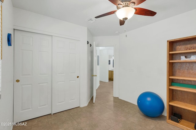 10140 E Pleasant View Way, Tucson, AZ 85748 - exercise room featuring a ceiling fan, light tile patterned floors, and baseboards