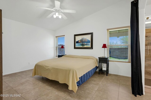10140 E Pleasant View Way, Tucson, AZ 85748 - bedroom featuring vaulted ceiling, multiple windows, light tile patterned flooring, baseboards, and a ceiling fan