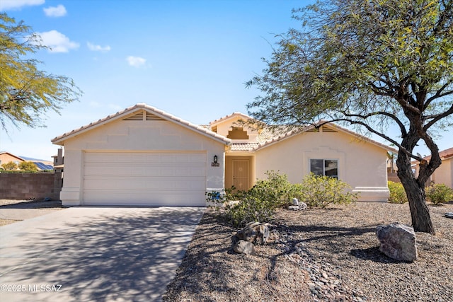 9586 E Paseo, San Bernardo, Tucson, AZ 85747 - view of front of house featuring stucco siding, a tile roof, driveway, and a garage
