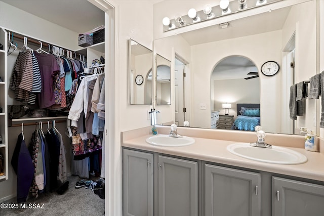 9586 E Paseo, San Bernardo, Tucson, AZ 85747 - ensuite bathroom featuring double vanity and a walk in closet