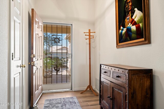 9586 E Paseo, San Bernardo, Tucson, AZ 85747 - foyer entrance with light wood-type flooring and baseboards