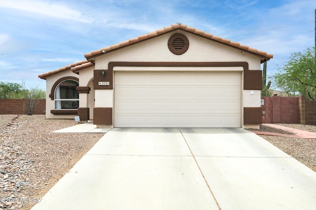 3521 W Camino De Talia, Tucson, AZ 85741 - view of front of house featuring concrete driveway, stucco siding, a garage, and a tiled roof