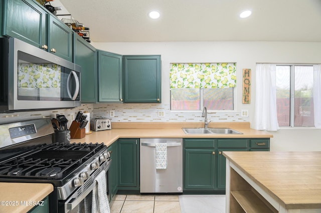3521 W Camino De Talia, Tucson, AZ 85741 - kitchen featuring stainless steel appliances, green cabinets, a sink, light countertops, and recessed lighting