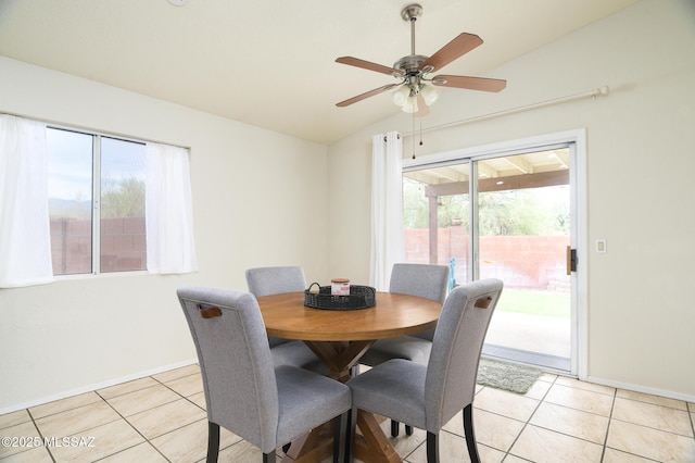 3521 W Camino De Talia, Tucson, AZ 85741 - dining area featuring lofted ceiling, light tile patterned floors, a ceiling fan, and baseboards