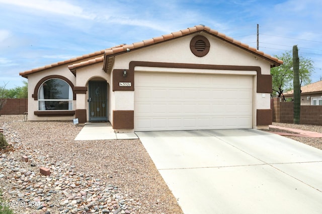 3521 W Camino De Talia, Tucson, AZ 85741 - view of front of home featuring stucco siding, concrete driveway, a garage, and a tile roof