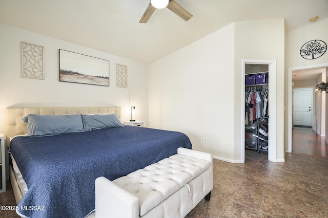 3521 W Camino De Talia, Tucson, AZ 85741 - bedroom featuring a spacious closet, vaulted ceiling, baseboards, stone finish flooring, and a closet