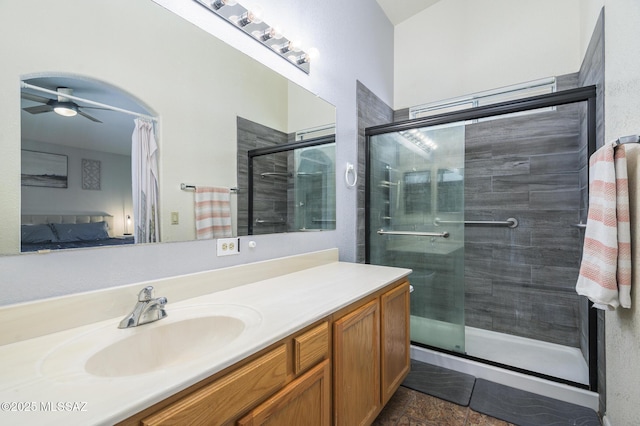3521 W Camino De Talia, Tucson, AZ 85741 - ensuite bathroom with vanity, a shower stall, and a ceiling fan