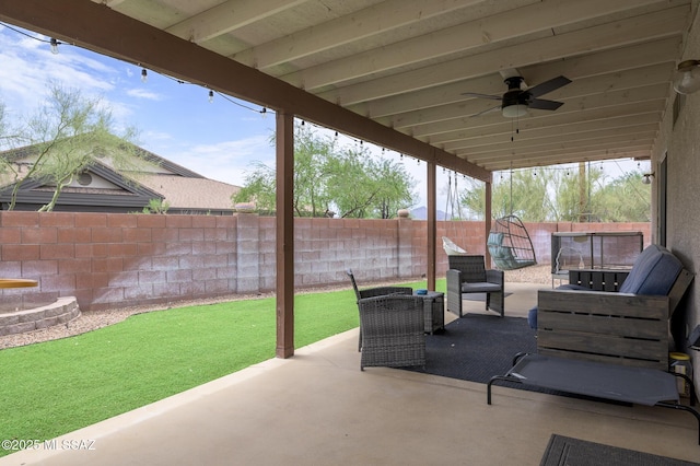 3521 W Camino De Talia, Tucson, AZ 85741 - fenced backyard with a patio area, a ceiling fan, and an outdoor living space
