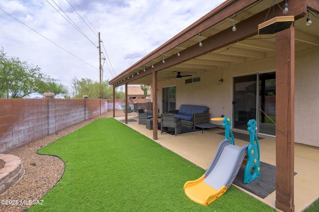 3521 W Camino De Talia, Tucson, AZ 85741 - fenced backyard featuring a patio area, outdoor lounge area, and ceiling fan
