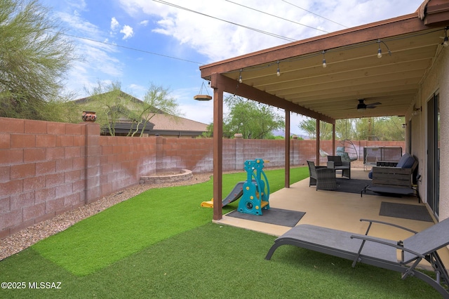 3521 W Camino De Talia, Tucson, AZ 85741 - view of yard featuring ceiling fan, a patio, and an outdoor hangout area