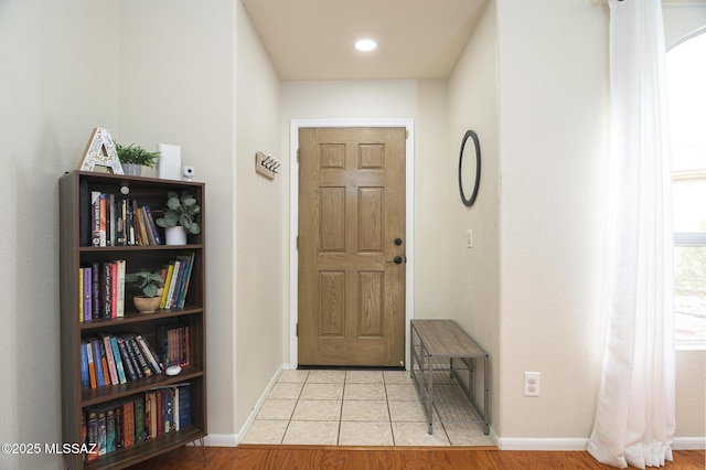 3521 W Camino De Talia, Tucson, AZ 85741 - entrance foyer featuring baseboards, light tile patterned floors, and arched walkways