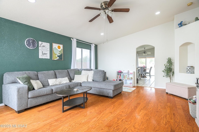 3521 W Camino De Talia, Tucson, AZ 85741 - living room featuring a ceiling fan, light wood finished floors, recessed lighting, and arched walkways