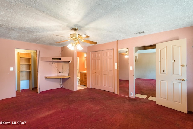 908 E Weymouth St, Tucson, AZ 85719 - unfurnished bedroom featuring a textured ceiling, carpet floors, connected bathroom, and ceiling fan