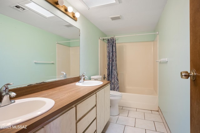 908 E Weymouth St, Tucson, AZ 85719 - bathroom with toilet, tile patterned floors, double vanity, and shower / bath combo