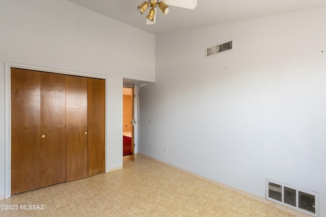 908 E Weymouth St, Tucson, AZ 85719 - unfurnished bedroom with light flooring, a closet, and ceiling fan